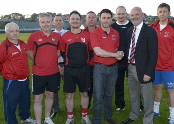 Banbridge Town Chairman Stephen Radcliffe and Banbridge AFC Chairman Simon Canning at the amalgamation of the two clubs, included is Colin Flynn (AFC 3rds Manager), Ryan Watson (Town FC Manager), Andrew Cully (Banbridge Town President), Mark Kerr (AFC 1st Team Coach), Anthony Blackburn (AFC Assistant Manager), Stewart McClimmonds (AFC Treasurer) and Chris Beattie (Reserves Manager)  © Edward Byrne Photography INBL1427-206EB