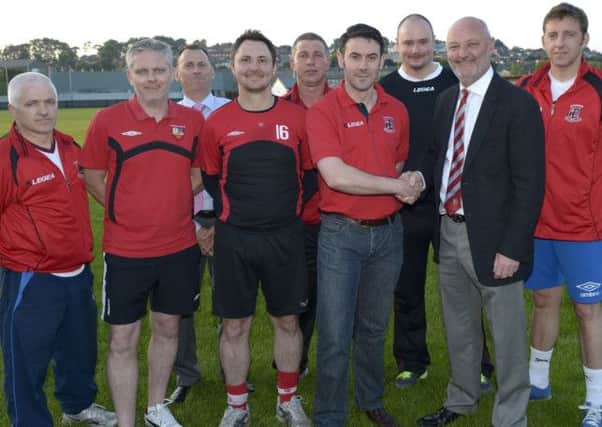 Banbridge Town Chairman Stephen Radcliffe and Banbridge AFC Chairman Simon Canning at the amalgamation of the two clubs, included is Colin Flynn (AFC Thirds Manager), Ryan Watson (Town FC Manager), Andrew Cully (Banbridge Town President), Mark Kerr (AFC 1st Team Coach), Anthony Blackburn (AFC Assistant Manager), Stewart McClimmonds (AFC Treasurer) and Chris Beattie (Reserves Manager)  Edward Byrne Photography INBL1427-206EB