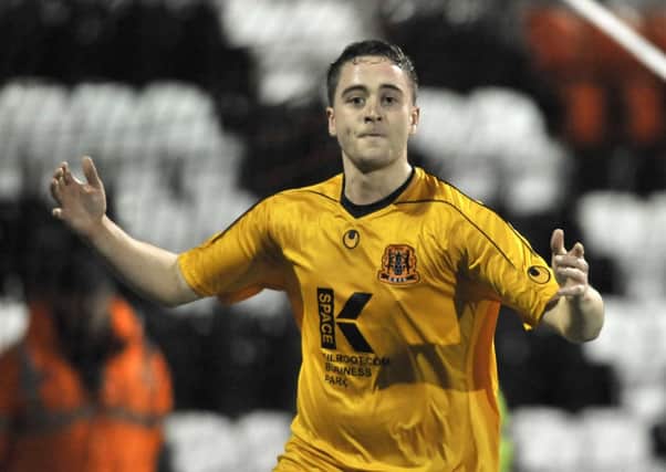 Shane Dolan celebrates after scoring for Carrick Rangers against Portadown in 2012. Photo: Presseye