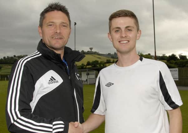 Dessie Gorman, Assistant Manager of Rathfriland Rangers, welcomes new club signing Johnny Kernaghan, from his former club Banbridge Town, for the incoming 2013-2014 season.  Photo: Gary Gardiner.  IN BL WK 2814-510.