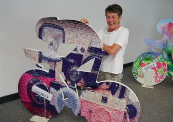 Bernie McAllister with her 'Pink Borough' sculpture, which sold for £150 at the auction in aid of Oxfam, the official sponsor of the Giro d'Italia 2014.  INLT 28-679-CON