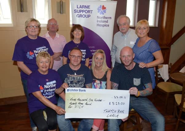 Roma Brown, Davina Adair and Pat Bell from the Larne Support Group of the Northern Ireland Hospice pictured receiving a cheque for £3123 raised at the Eagle Vs Thatch football match held at Inver Park in memory of Rebekah Bunting. With Rebekah's parents Louise and Mervyn are Robert Bell, Ignatius McAlornan from Carriages, Louise Weatherhead from the Eagle Bars and Nigel McWilliam's from the Thatch Bar. All funds raised will go towards refurbishing the play park at the N.I. Children's Hospice.  INLT 27-306-PR