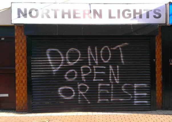 Graffiti on the shutter of the Northern Lights at Dunluce Street on Monday morning. INLT 28-639-CON