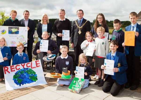 Bronze winners: Pictured here with the Mayor of Coleraine Borough Council, Cllr George Duddy, Angela Stewart, Commercial Manger, Autoline Insurance Group and MD of RiverRidge Recycling, Brett Ross is the Bronze Award winners, Maria McDowell and Aaron Kennedy from Macosquin PS, Samuel Kirk and Stefan Darragh from Sandleford Special School, Toni Donnelly and Zara Pollock from Carnalridge PS Portrush, Andrew Beggs and Roma Laverty from Christie Memorial PS, Coleraine, Mr Alan Brown Estate Manager, Coleraine Academical Institution, Victoria Lozowska from St Malachy's PS and Emmett Brolly and Joseph Mullholland from Loreto College. INCR29-116(S)