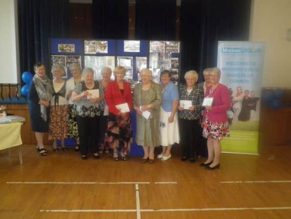 Mrs Phyllis Grothier All-Ireland Mothers Union President who presented long service certificates to Lambeg MU members Elsie White, Doris Wright, Harriet Skillen, Marcella Gill, Dorothy McReynolds, Molly Craig, Rosalind Bloomfield, Isobel Haire, Helen Law and Valerie Ash Connor Diocese Mothers Union President.