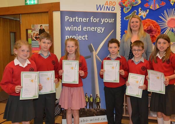 Hazelbank PSl pupils, Georgia Kidd, Jacob Bradley, Lea Dobbin, Ethan McClintock, Nicole Clugston and Charlie Whyte, with their ABO Wind Energy Certificates, which were received from Tamsin Fraser (Head of Development) of AOB Wind Energy. INBT27-236AC