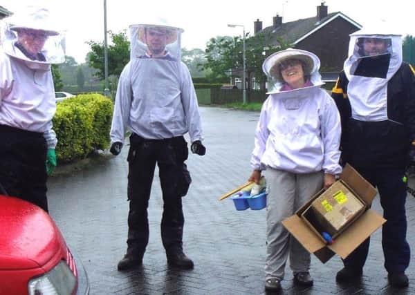 Hugh Holmes (left) with Christina Bradley Eamonn Morgan and Rory McGeary arriving to remove a swarm from a home in Armagh.