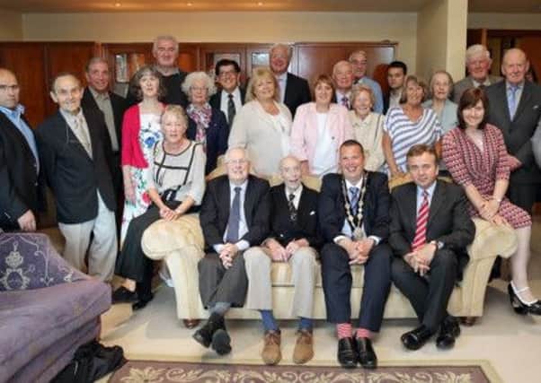 Arthur Norris, seated, second from left, celebrated his 100th birthday with a visit to Lisburn Civic Centre. Mr Norris, a former principal at Fort Hill school (from 1996-79), is pictured with, seated, from left, Bert Gibson, Fort Hill principal from 1979-1993, Mayor Andrew Ewing and Clive Anderson, current principal at Fort Hill from 2011-present, along with friends, family and councillors.  US1428-553cd  Picture: Cliff Donaldson