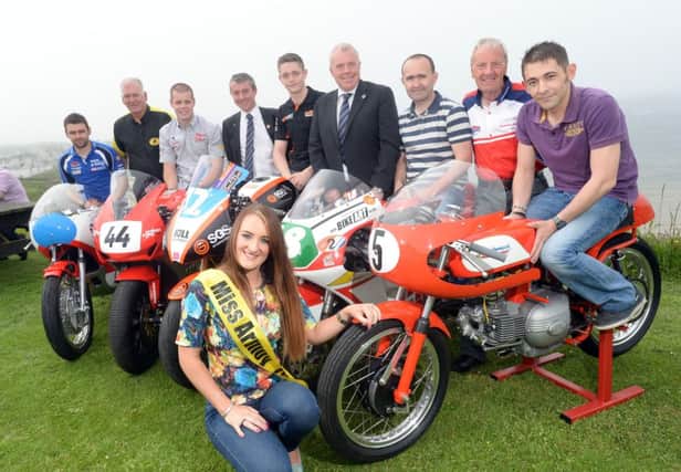 KMR Kawasaki SGS International team set for Armoy. Pictured here are Miss Armoy 2013, Rachael Davis with road racers William Dunlop, Jamie Hamilton, KMR/SGS Kawasaki Connor Behan, Paul Robinson, Billy Bamber and Sam Dunlop and Bill Kennedy, Clerk of the Course, Ian Lamont, Sales Manager and David Boyd, Retail Operator at Roadside Garages, sponsors of the 650 Super Twin race. inbm29-14 s