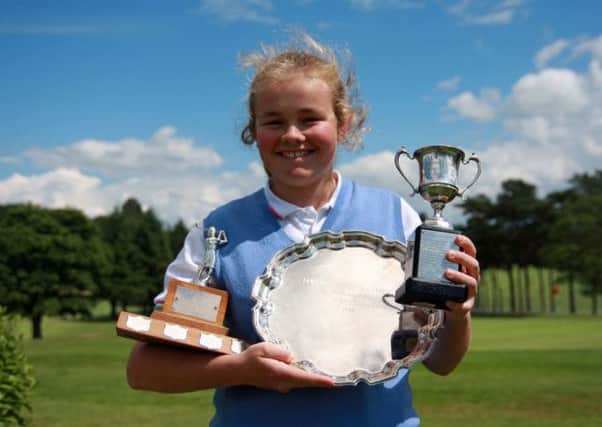 Annabel Wilson with her trophies.