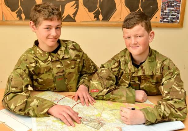 Charting their success at summer camp are Cadets Tyler Crooks and Andy Bell, from Monkstown ACF Detachment. INNT 29-450-CON
