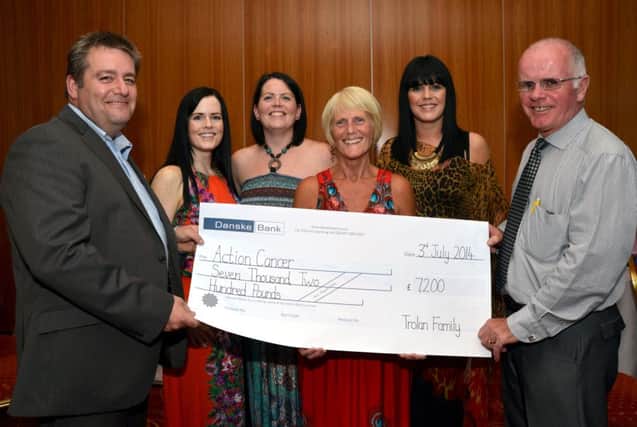 John Kivlahan, Corporate Fund Raising for Action Cancer receives a cheque for £7,200 from Ursula Trolan, Charlene Trolan-Gibney, Mary Trolan, Aine Trolan and Patsy Trolan. INBM28-14 S