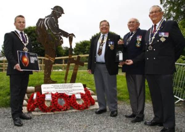 Mayor Thomas Hogg launches the Lights Out campaign which will be marked by a candlelight vigil at the replica WW1 trench site at Mossley Mill on August 4. Attending the launch were Billy Snoddy (Carnmoney RBL), Ivan Hunter (Whiteabbey RBL) and John McCormick (Ballyclare RBL). INNT 29-500CON