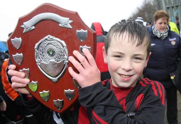 Hillsborough Boys captain Sam Millar holds up the trophy after his side beat Portadown 1-0 in the under-13 Lisburn Junior Invitational League finals. US1402-501cd Pic: Cliff Donaldson
