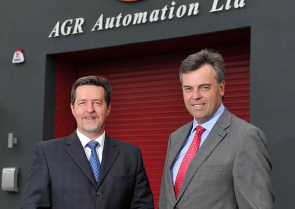 (right) Alastair Hamilton, Chief Executive of Invest NI which has offered £220,000 of support for the 22 jobs being created by AGR Automation Ltd.'s setting up of an engineering site in Ballymena Picture: Michael Cooper