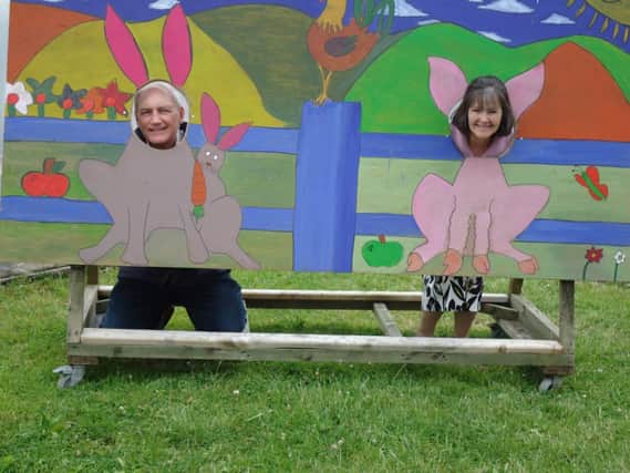 Bishop Michael Maxwell and his wife Clare at the wooden backdrop created by Newtownabbey congregation of the Church of Jesus Christ of Latter Day Saints as part of the project at Kilcreggan Urban Farm. INCT 29-707-CON