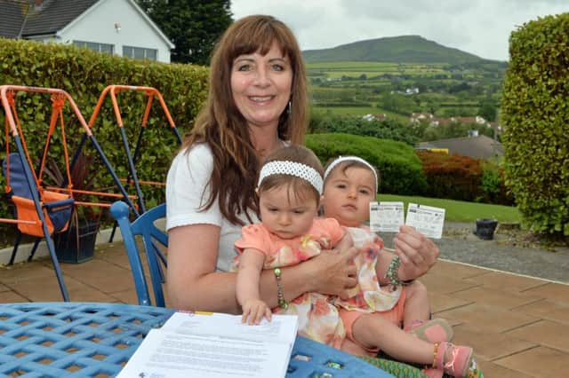 Louise McCabe with twins Lilianna and Isabella and parking tickets. INLT 28-011-PSB