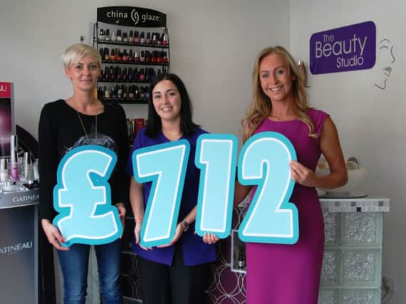The Beauty Studio Relay Team from Carrickfergus raised £712 for Cancer Focus Northern Ireland through the Belfast City Marathon 2014. Pictured (from left to right) are Marta Kurtz, Charlotte Manning and owner  Veronica Dolan (Claire Barefoot and Dylan Ritchie were the other two members of the team). INCT 29-702-CON