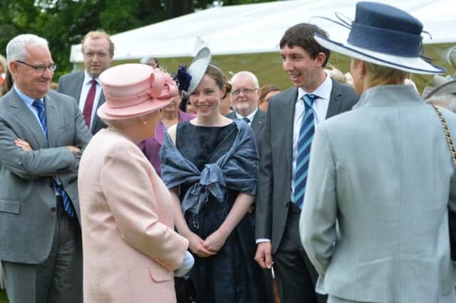 Steam rail enthusiasts Mark and Ruth Walsh meeting the Queen at Hillsborough Castle (photo by Aaron McCracken/Harrison Photography). INCT 29-706-CON