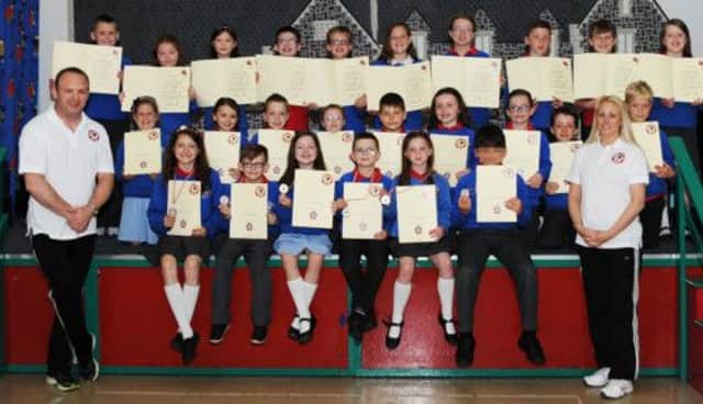 Pupils from Ballymena Primary School, who completed their Sport Ju-Jitsu for Schools course & awarded with their Certificates by International Ju-Jitsu Coaches Paul Timperley (6th Dan National Coach) and Mandi Timperley (2nd Dan).
