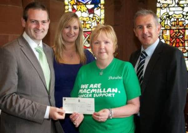Former Mayor Councillor Martin Reilly with his wife Bronagh, handing over a cheque for £19,000 from the Mayor's Charity to Paul Sweeney and Deirdre Campbell, Macmillan Cancer Support.