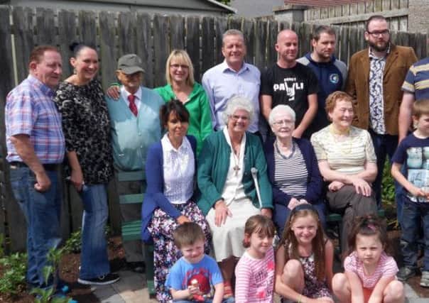 Housing Executive staff, elected representatives and members of Killowen Drive Residents Association pictured at the opening of the community garden.