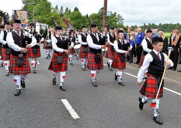 Big turn out for the Braid Parade from Broughshane Pipe Band after only a few years of being formed. INBT 29-815H