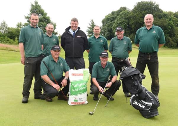 Rodney MacKay, of Galgorm Castle Golf Club, and William Cartmill, Coburns, check out the condition of the course at Galgorm Castle Golf Club ahead of next months NI Open. Looking (back row) are Galgorm Castle grounds staff Chris Warnock, Richard MacKay, Mervyn McDowell, David Snoddy, Adrian Crowe and Brian Hughes.