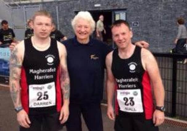 Darren Church [left] and Niall Higgins with Dame Mary Peters.
