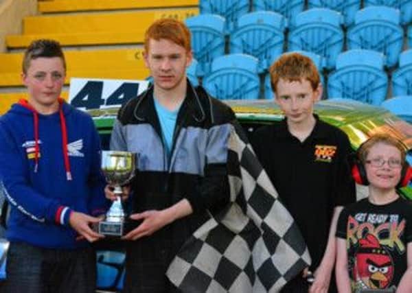 Junior Rod Supreme Champion Aaron Moody collects his award from Harry Gilmore of Gilmore Engineering and Raceway mascots Andrew Johnston and Thomas Kirk. Picture: Gilmore Race Photography.