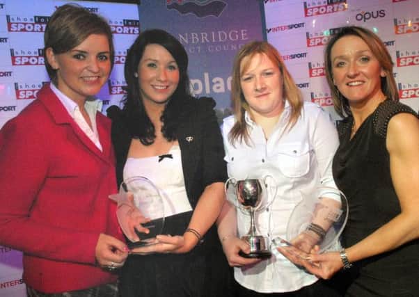 Dromore girl Louise Aiken receives the sportswoman of the year award at the 2011 Banbridge District Senior Sports Awards from Yvonne Jackson. Also pictured is Denise Watson presenting Ulster and Ireland Rugby star Eliza Downey with her runners-up sportswoman of the year award.