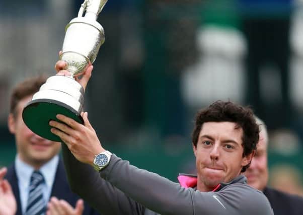 Rory McIlroy celebrates with the Claret Jug after winning the 2014 Open