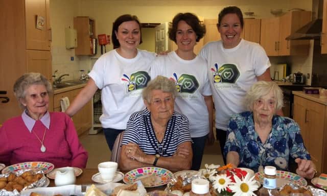 The Lidl Surprises team with residents at Abbeyfield House Greenisland. INCT 30-754-CON