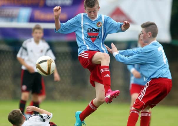 Carniny Youth's Eamon McAllister and Joshua Courtney in the thick of the action during Monday's under-13 Hughes Insurance Foyle Cup match against Sheffield United. Picture: Lorcan Doherty Photography.
