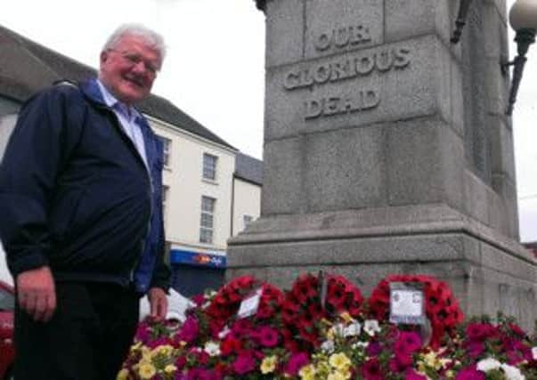Rev. Norman Porteous at the cenotaph in Cookstown