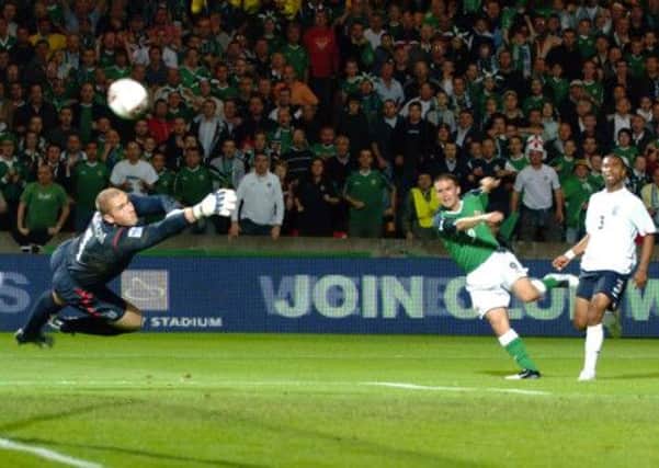 David Healy scores the goal which beat England in the World Cup Qualifier against England.