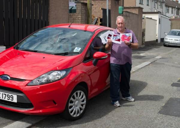 Richmount Gardens, Lurgan. Ronnie Menary with his car that was damaged during Road Service work.  INLM3014-411