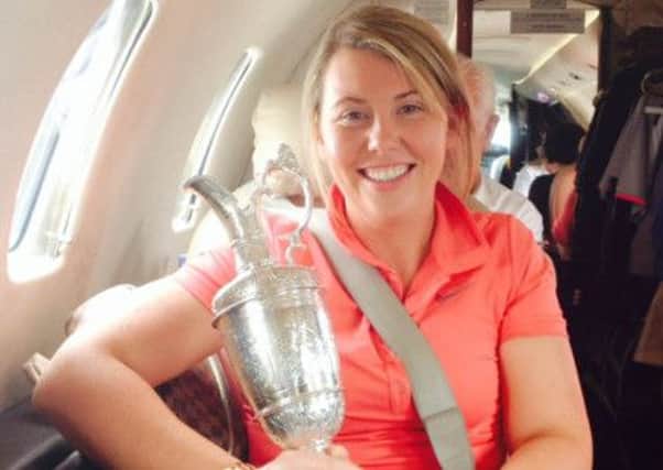 Flying home in style with the Claret Jug is Lurgan's Michelle Madden, Rory's cousin who had a weekend to remember in Liverpool.