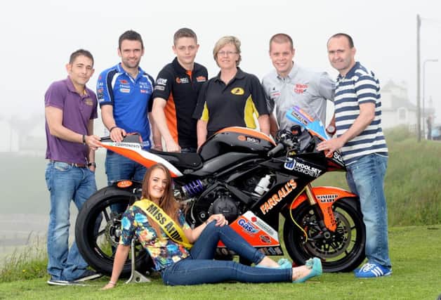 AnnLouden Race with Road Racers: Ann Louden, Race Secretary of the AMRRC has along with husband, Peter, donated a Two-Stroke Man of the Meeting Award. Ann Louden is pictured with Rachael Davis, Miss Armoy 2013 and road racers Sam Dunlop, William Dunlop, Connor Behan, Jamie Hamilton and Paul Robinson. inbm31-14s