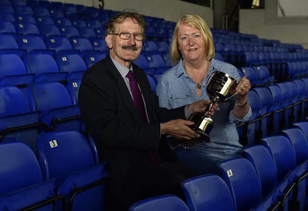 Milk Cup chairman Victor Leonard with Norma McClarty and the David McClarty Fair Play Trophy.