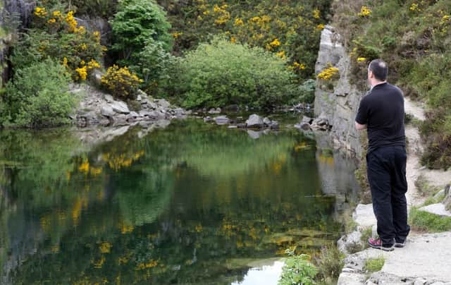 The remote disused quarry in rural Co Down, Northern Ireland, where Colin Polland died in a bid to save Kevin O'Hare 15, who got into difficulties when swimming in the quarry, but also died. PRESS ASSOCIATION Photo. Picture date: Sunday June 2, 2013. Colin Polland is understood to have jumped into the water at the isolated quarry to save Kevin O'Hare, who had got into difficulties when swimming.  Paul Faith/PA Wire