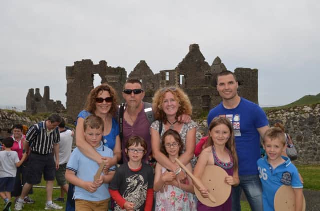 FAMILY AND FRIENDS....Darren, Andrea, EB and Paul pictured with children Joshua,  Ashton, Teegan, John, and Caitlin at the Medieval fun at Dunluce Castle. inbm31-14s