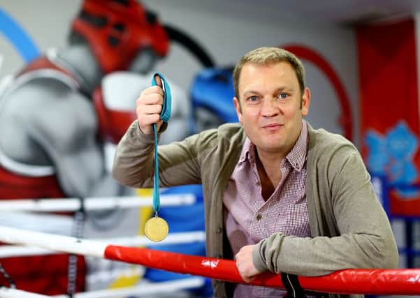 Neil Sinclair pictured at Monkstown Boxing Club with his Commonwealth gold medal from 20 years ago. Photo: Presseye