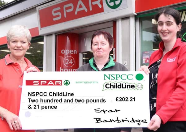 Spar Banbridge Staff Joanne McColgan, Caron Miskimmin and Store Manager Patricia Conaty with their charity cheque for NSPCC ChildLine.