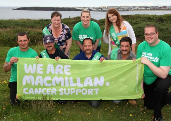 Maria Small of Macmillan Cancer Support pictured with a group of people from Portrush who have organised a sponsored Onesie Walk on August 16. INCR30-309PL