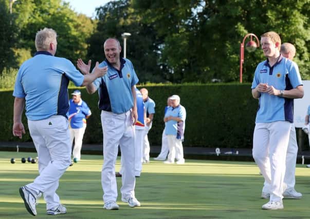 Nigel Robinson congratulates Stevie Falls after his end winning bowl during last week's league game with Ewarts. INBT 31-170CS