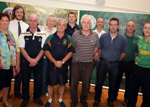 BEHIND THE SCENES. Danny Quinn, Chairman of Dunloy Cuchullains, pictured along with committee members at the U-14 medal ceremony on Tuesday night including Daniel Taylor from Ballymoney Museum.INBM31-14 002SC.