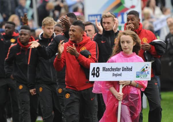 Pacemaker Press 27/7/2014
Man Utd   during the  opening parade of the  Dale Farm Milk Cup, all competing teams left the Diamond in the centre of Coleraine and then into The Coleraine Show Grounds on the Sunday evening before the matches kick off the following day. 
 Pic Colm Lenaghan/Pacemaker