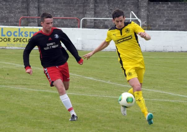 Larne and Cliftonville chase for the ball in their friendly at Inver Park  INLT 32-237-AM