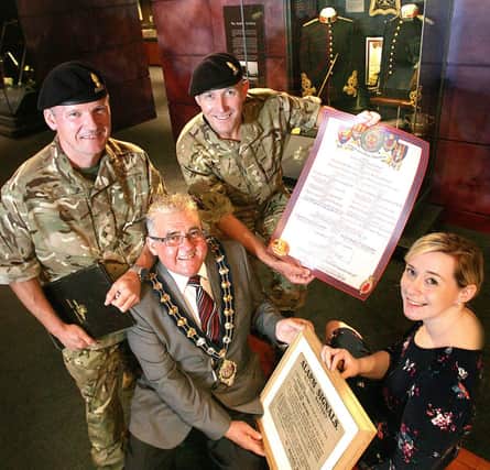 Captain Paddy Shields and Captain Ken Blues from 591 Independent Field Squadron, based at Bangor Army Reserve Centre, visited Carrickfergus Museum, with the Mayor, Alderman Charlie Johnston and Shirn Murphy,  Collections Access officer. INCT 31-706-CON